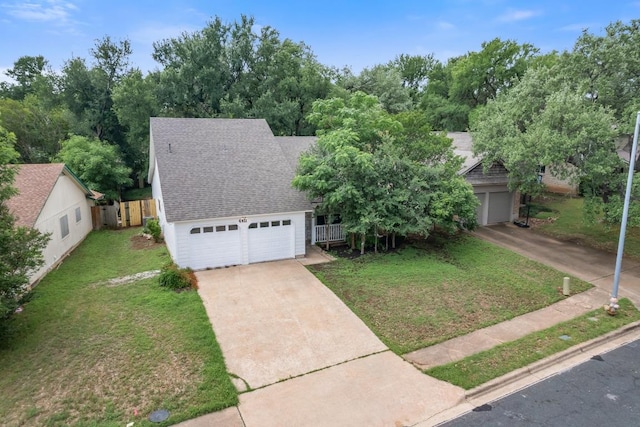 4411 Cumbria Ln, Austin, TX 78727 - view of front facade featuring roof with shingles and a detached garage