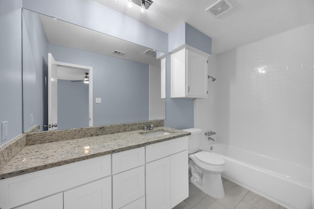 bathroom with toilet, vanity, ceiling fan, and shower / tub combination