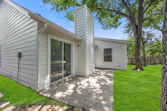 4411 Cumbria Ln, Austin, TX 78727 - back of property with a patio area and a chimney