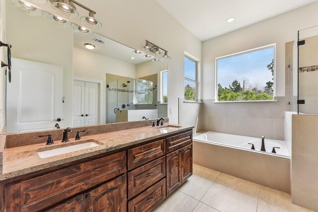 full bath featuring visible vents, a shower stall, a sink, and a bath