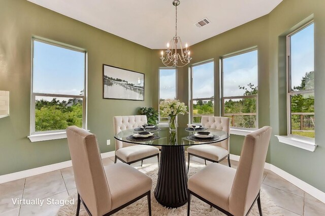 dining room featuring baseboards, light tile patterned floors, a notable chandelier, and visible vents