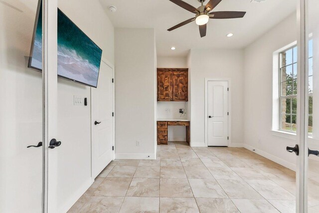 spare room featuring baseboards, recessed lighting, ceiling fan, and french doors