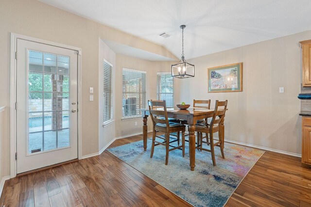 14529 Wharton Park Trl, Austin, TX 78717 - dining room featuring dark wood finished floors, baseboards, and a chandelier