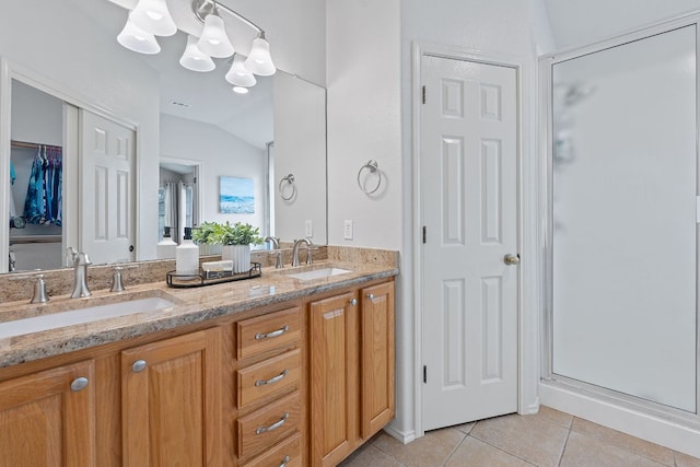 14529 Wharton Park Trl, Austin, TX 78717 - bathroom featuring tile patterned flooring, lofted ceiling, a shower stall, a chandelier, and double vanity
