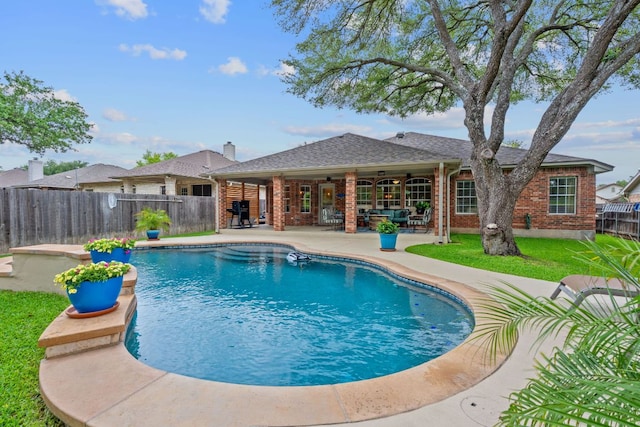 view of swimming pool with a fenced backyard, a fenced in pool, and a patio area