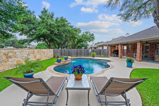 view of swimming pool with a fenced backyard, a fenced in pool, and a patio