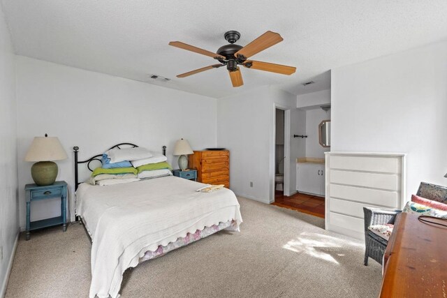 bedroom featuring carpet flooring, ceiling fan, and visible vents