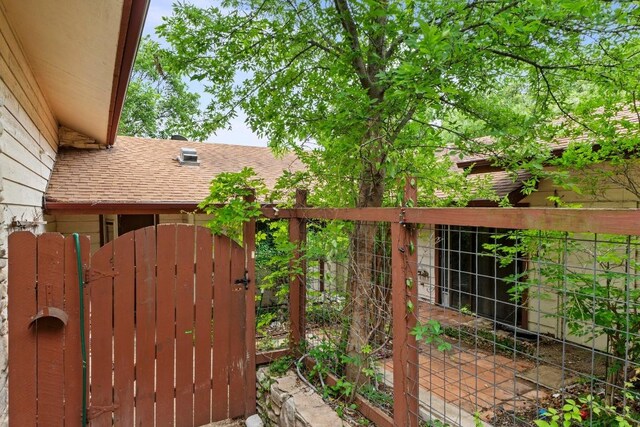 view of gate featuring fence