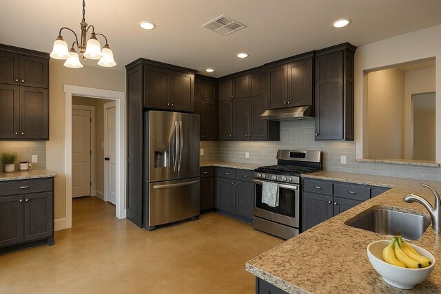 kitchen featuring dark brown cabinetry, visible vents, a sink, under cabinet range hood, and stainless steel appliances