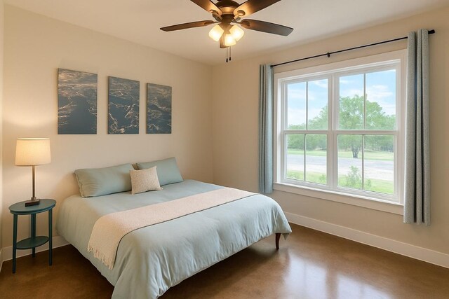 bedroom with a ceiling fan and baseboards