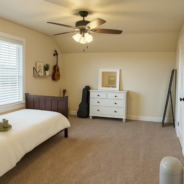 bedroom featuring baseboards, carpet, ceiling fan, and lofted ceiling