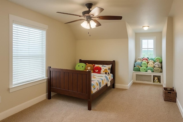 bedroom with baseboards, ceiling fan, carpet, and lofted ceiling