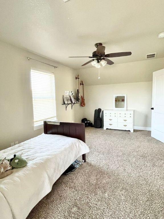 923 Debco Ln, Spicewood, TX 78669 - carpeted bedroom with ceiling fan