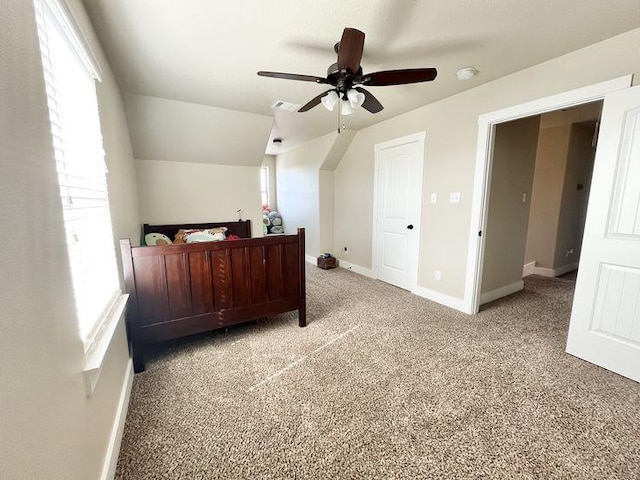 923 Debco Ln, Spicewood, TX 78669 - bedroom featuring multiple windows, light colored carpet, and baseboards