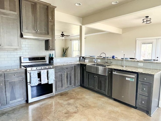 923 Debco Ln, Spicewood, TX 78669 - kitchen featuring appliances with stainless steel finishes, under cabinet range hood, a sink, plenty of natural light, and beam ceiling