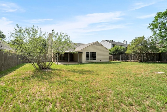 view of yard featuring a patio and a fenced backyard