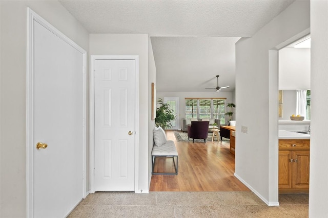 hallway featuring baseboards