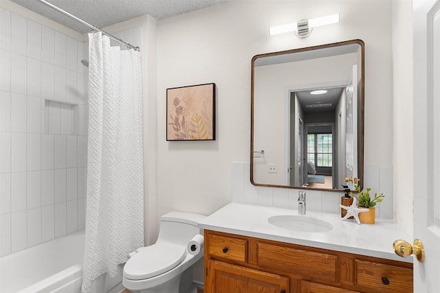 full bath with toilet, shower / tub combo with curtain, and vanity
