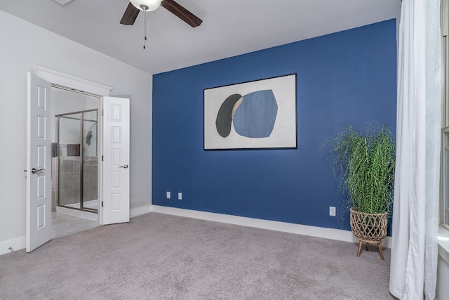 1766 Rowdy Loop, Leander, TX 78641 - unfurnished bedroom with baseboards, carpet flooring, a ceiling fan, and ensuite bathroom