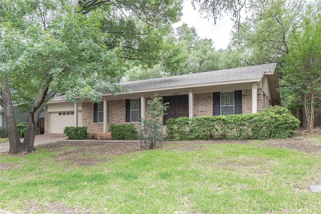 ranch-style home featuring an attached garage, a front lawn, brick siding, covered porch, and driveway