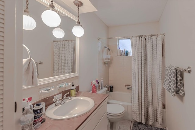 bathroom with vanity, shower / bath combination with curtain, and toilet