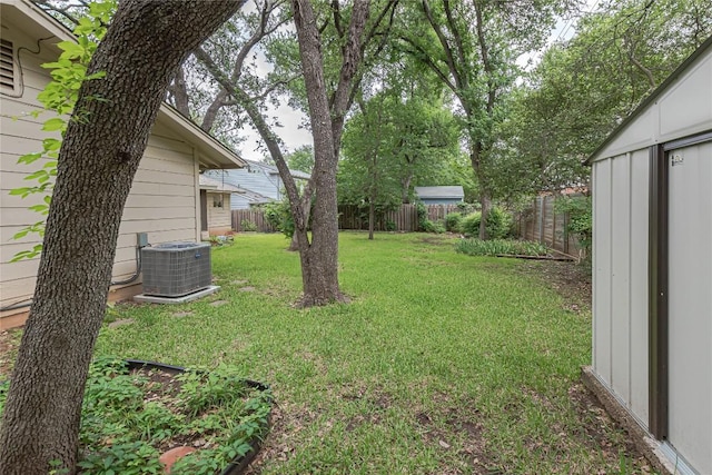view of yard with cooling unit and a fenced backyard