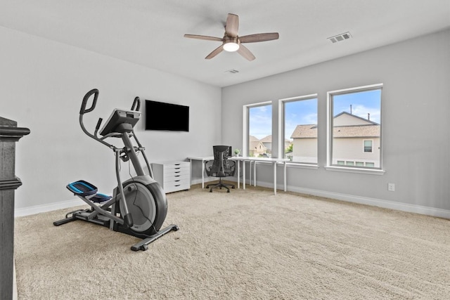 workout area featuring visible vents, a ceiling fan, baseboards, and carpet floors