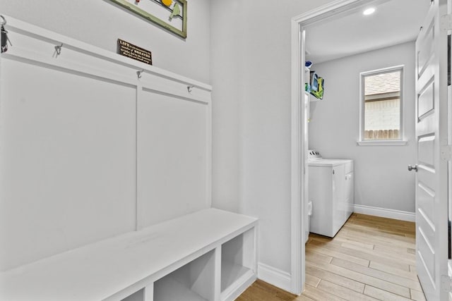 120 Freeman Loop, Liberty Hill, TX 78642 - mudroom featuring washer and clothes dryer and light wood finished floors