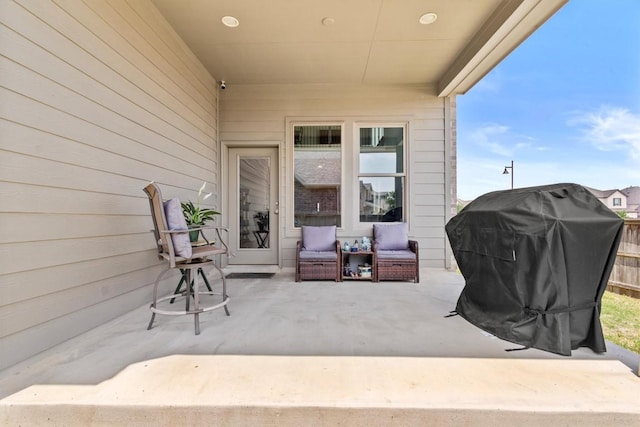 view of patio / terrace with an outdoor living space and a grill