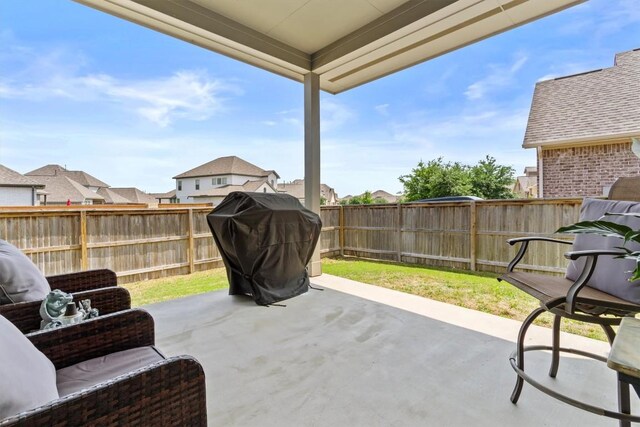 120 Freeman Loop, Liberty Hill, TX 78642 - fenced backyard with a grill and a patio