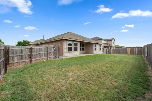 1364 Star Mdw, Kyle, TX 78640 - rear view of house featuring a fenced backyard and a patio