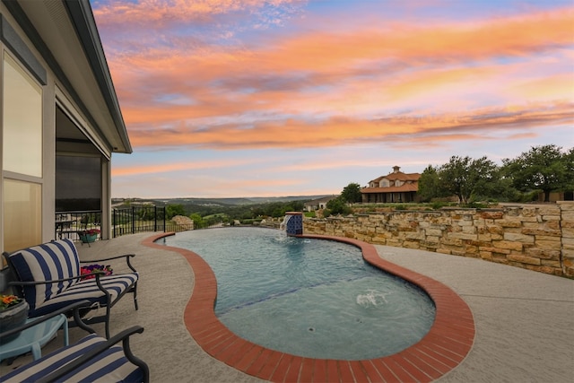 view of swimming pool featuring a fenced in pool
