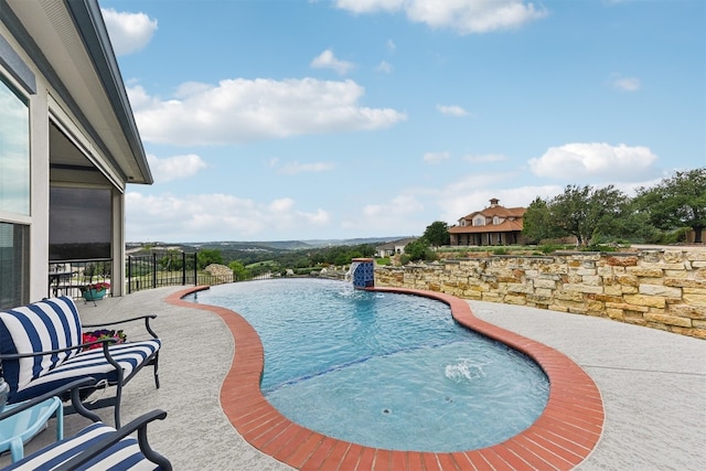 view of pool with a fenced in pool and a patio