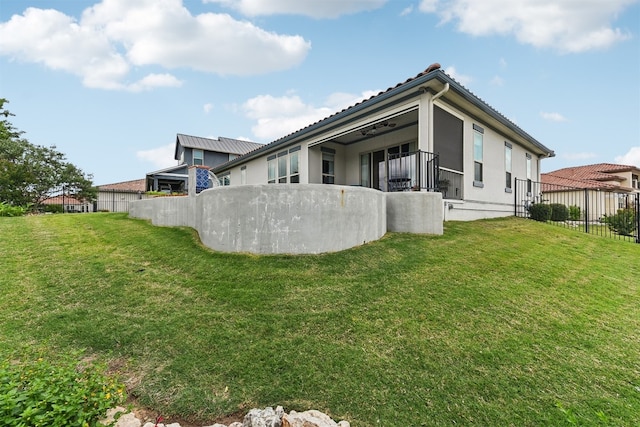 rear view of property with fence and stucco siding