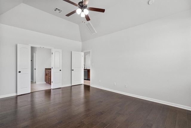 unfurnished bedroom featuring high vaulted ceiling, baseboards, wood finished floors, and visible vents