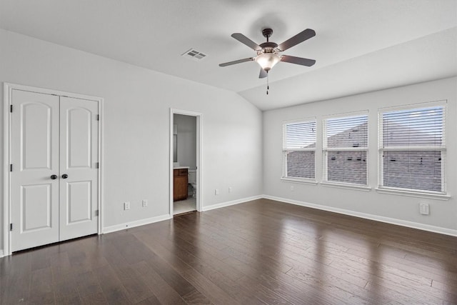 8105 Porto Cv, Round Rock, TX 78665 - unfurnished bedroom with vaulted ceiling, wood finished floors, ensuite bath, a ceiling fan, and a closet