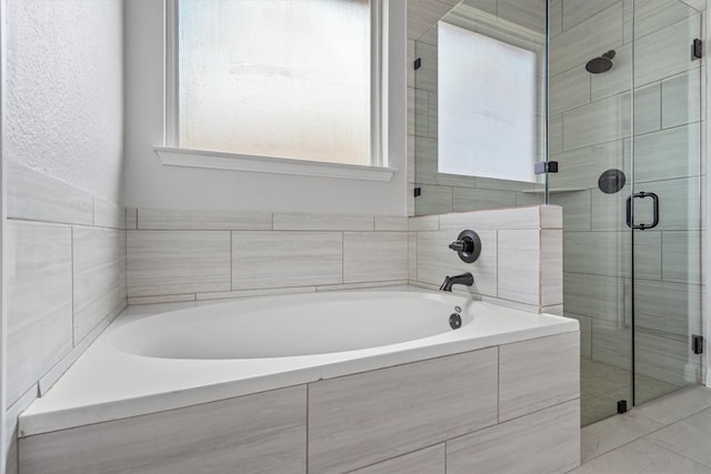 8105 Porto Cv, Round Rock, TX 78665 - bathroom featuring a shower stall and a bath