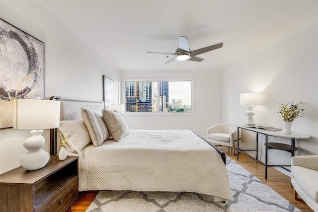 40 N Interstate 35 Unit 10B1, Austin, TX 78701 - bedroom featuring dark wood-style floors and ceiling fan
