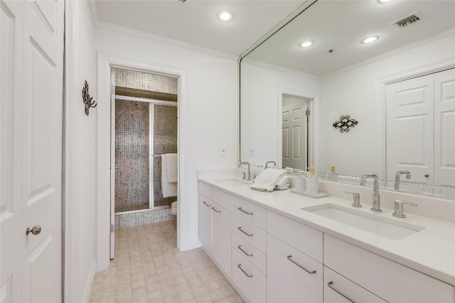 40 N Interstate 35 Unit 10B1, Austin, TX 78701 - bathroom featuring crown molding, double vanity, a shower stall, tile patterned flooring, and recessed lighting