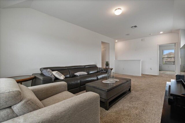 living area with visible vents, carpet flooring, lofted ceiling, and recessed lighting