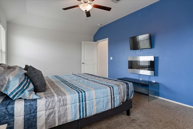 bedroom with baseboards, a ceiling fan, carpet, and vaulted ceiling