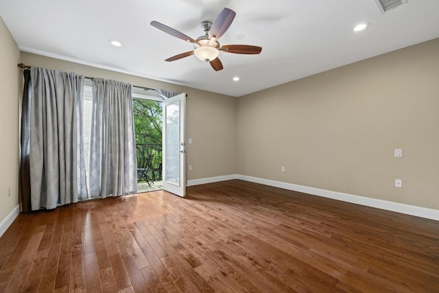 empty room featuring visible vents, wood finished floors, baseboards, recessed lighting, and a ceiling fan