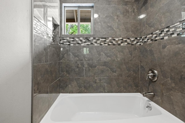 bathroom with shower / bathtub combination