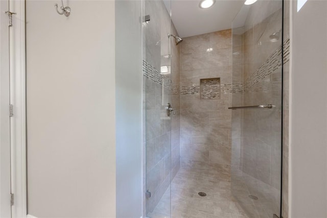 full bathroom with a stall shower and recessed lighting