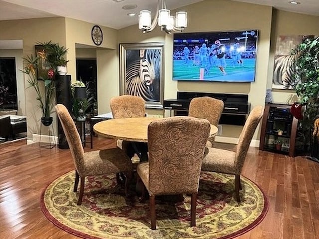 7504 Creekbluff Dr, Austin, TX 78750 - dining area featuring a chandelier, wood finished floors, and recessed lighting