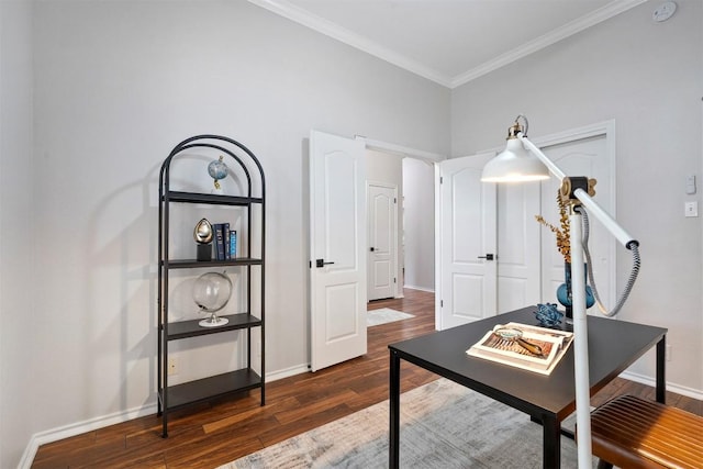 home office featuring dark wood-type flooring, ornamental molding, and baseboards