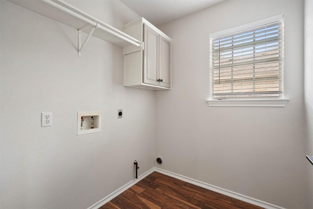 laundry room with cabinet space, hookup for a washing machine, dark wood finished floors, gas dryer hookup, and hookup for an electric dryer