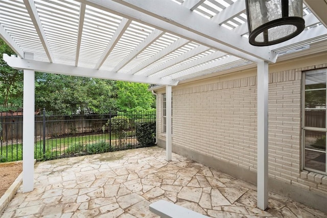 view of patio / terrace featuring fence and a pergola