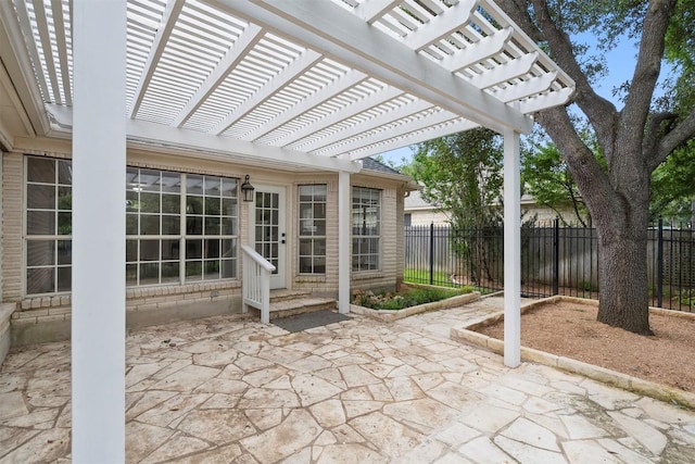 view of patio / terrace with fence and a pergola