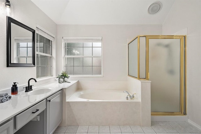 full bathroom with a bath, a shower stall, tile patterned flooring, and vanity